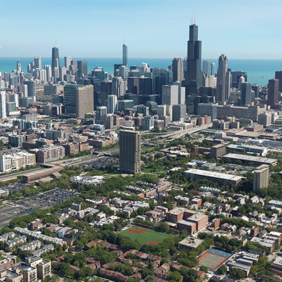 An aerial view of the Chicago skyline, with Lake Michigan in the background and the UIC campus in the foreground.