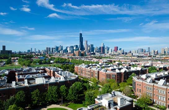 An aerial view of the University Village apartments, with the Chicago skyline in the background.