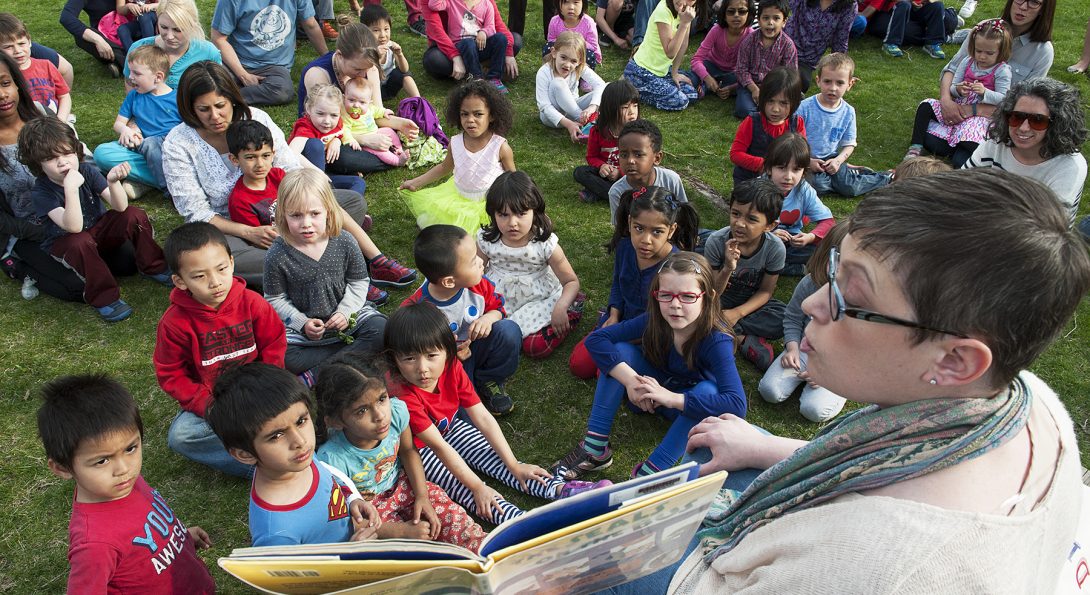 Early Childhood Educator reads to children