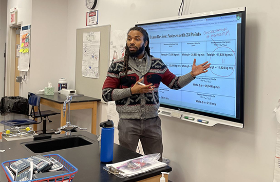 Darrin Collins, UIC PhD student and science teacher at Englewood STEM High School, teaching in his classroom.