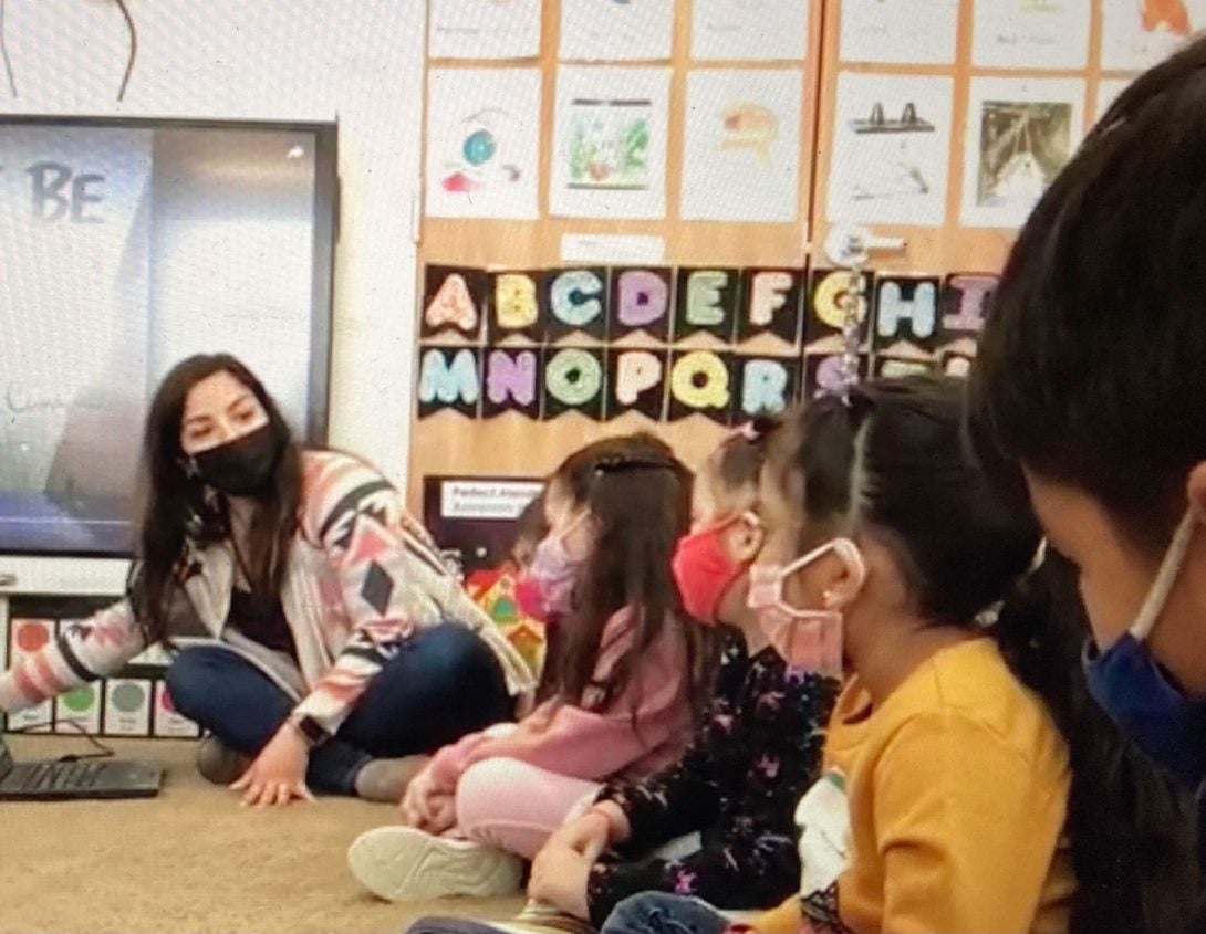 teacher working with children